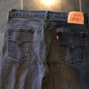 Levis faded black 514 straight leg jeans